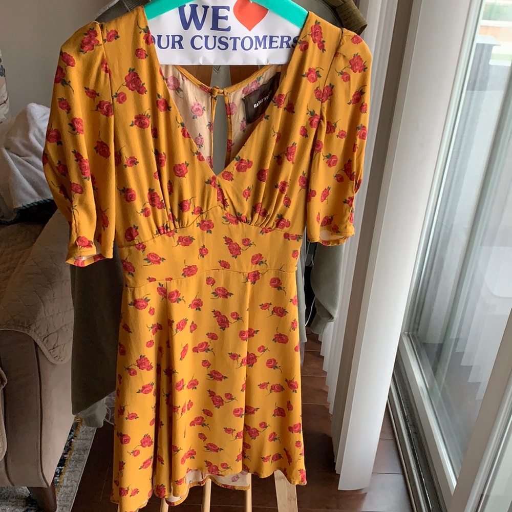 Reformation mini dress (yellow with red roses) size 0 slightly puffy sleeves